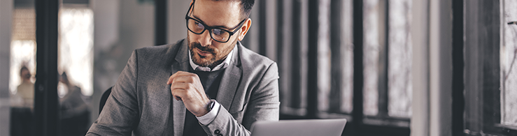 Thin image lone man at laptop